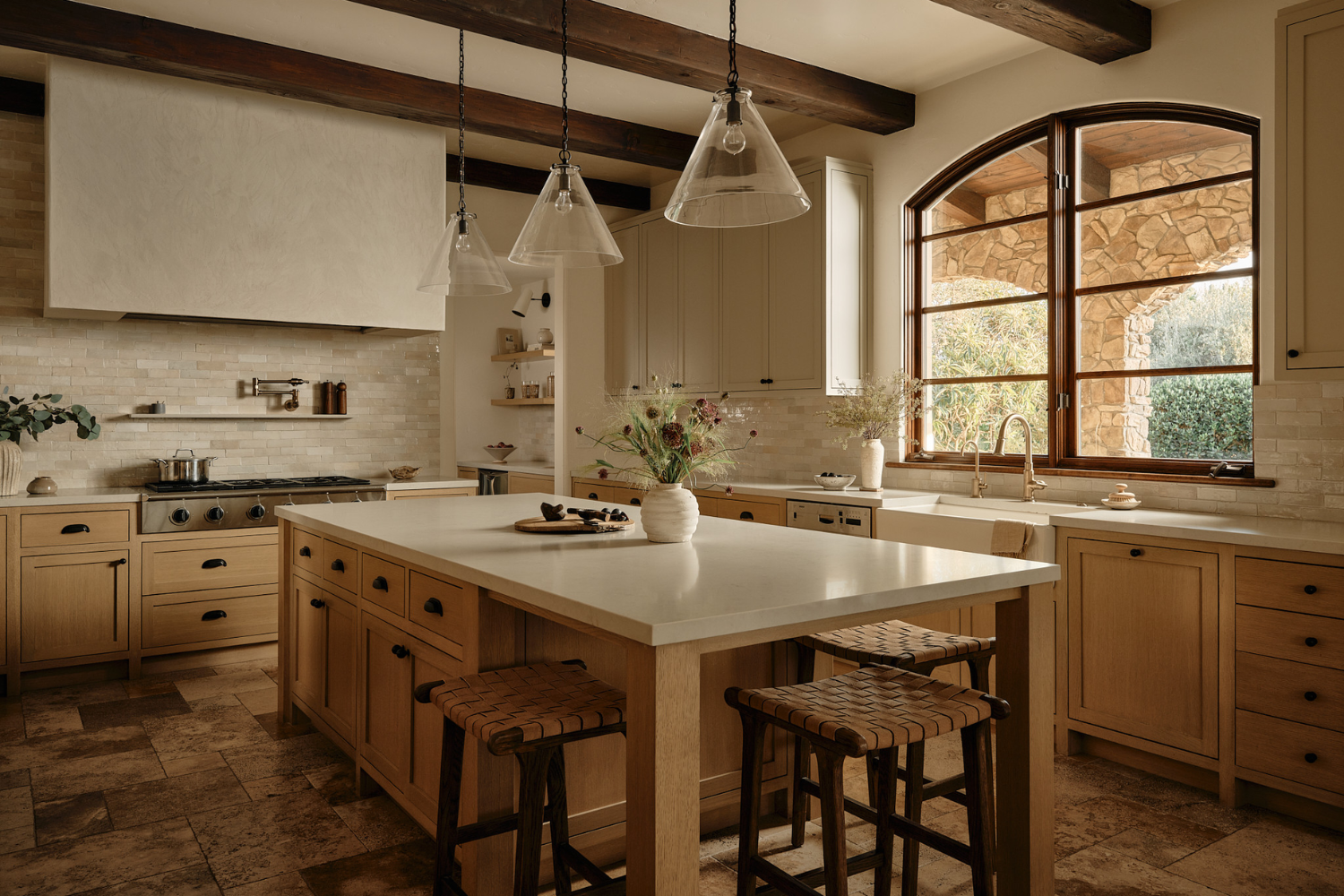 Organic Modern kitchen with wood cabinetry, stone surfaces and minimal contemporary details