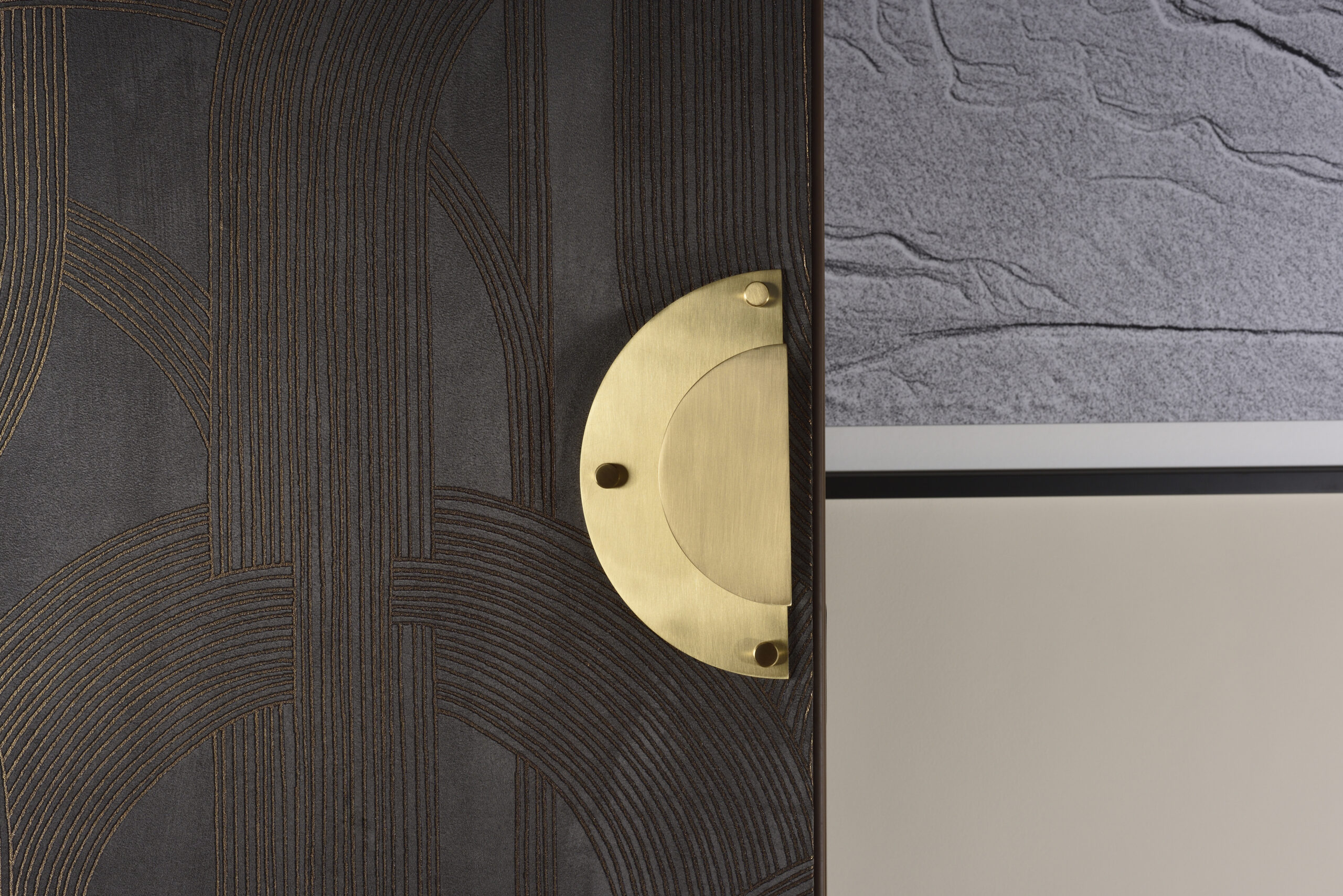 Detail of a Fama Design handle with a gold finish on the door of Room 419 at the Imperiale Palace Hotel.