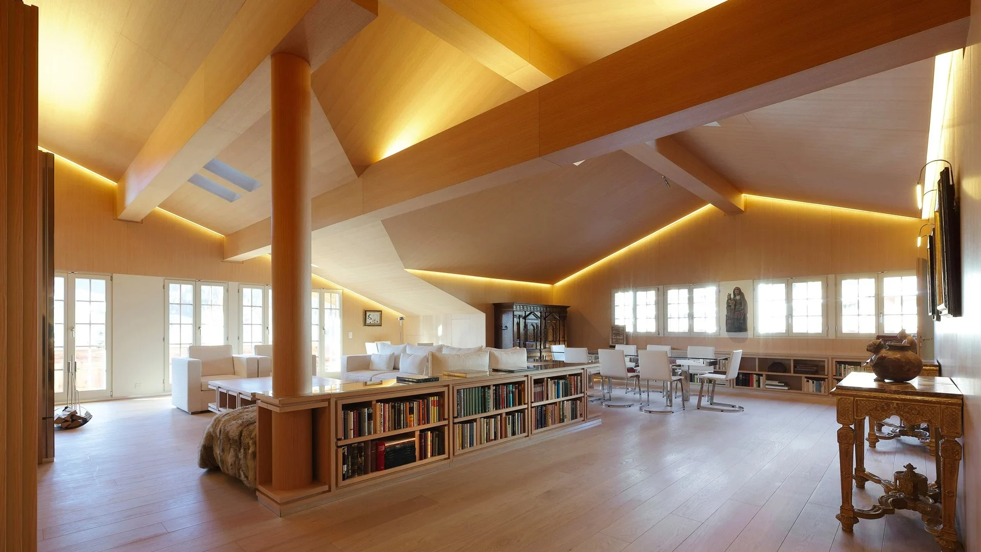 High-ceiling attic living room with timber cladding and bespoke Poliform furniture