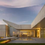 Contemporary villa with textured façades and large windows