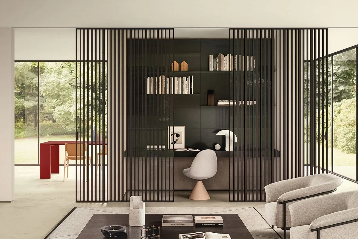 Sliding partition with dark vertical slats between living room and study area
