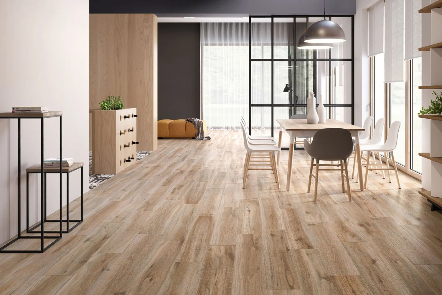 Living open space con zona pranzo e pavimento in gres porcellanato effetto legno naturale in formato 20x120