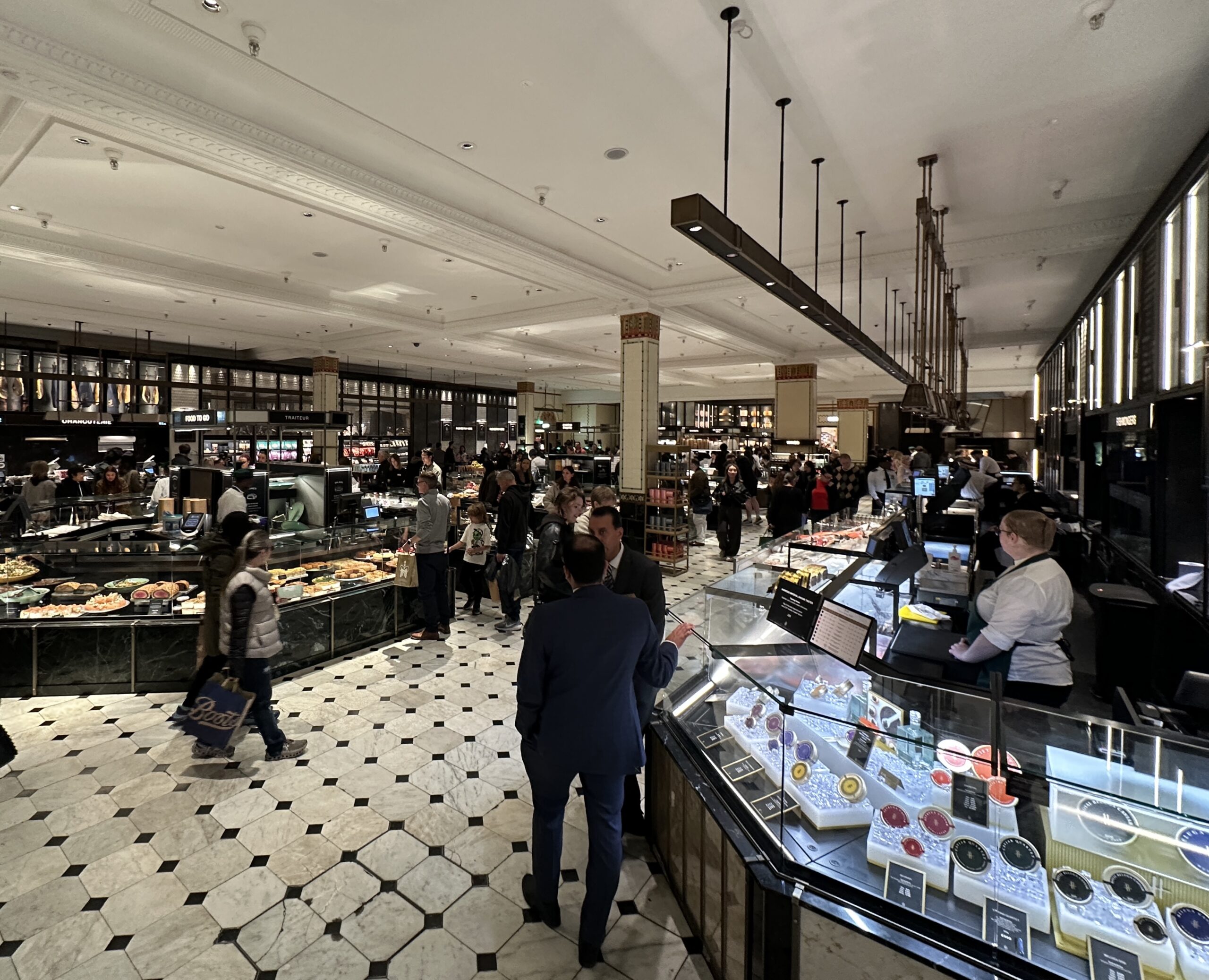 Food counters, suspended lighting and columns in the Harrods Food Halls