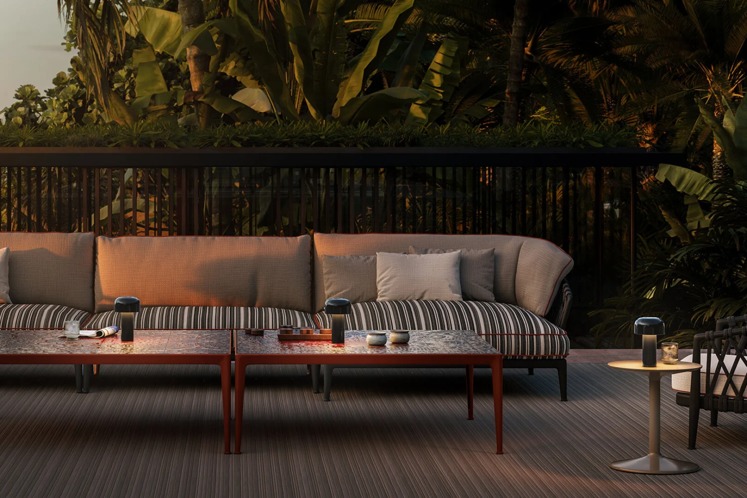 Flos Bellhop portable lamps on the coffee table of an outdoor living area