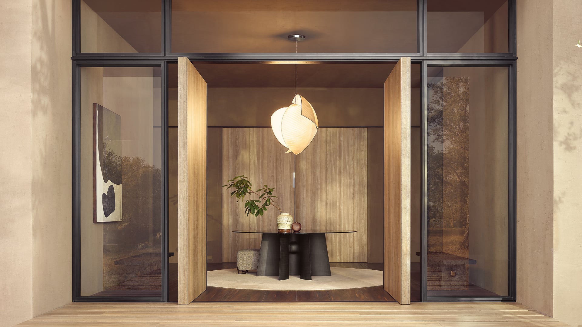 Sculptural pendant above a Poliform dining table
