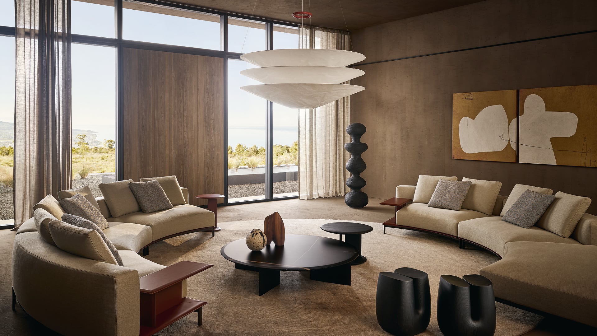 Poliform seating area with a sculptural pendant and floor-to-ceiling windows