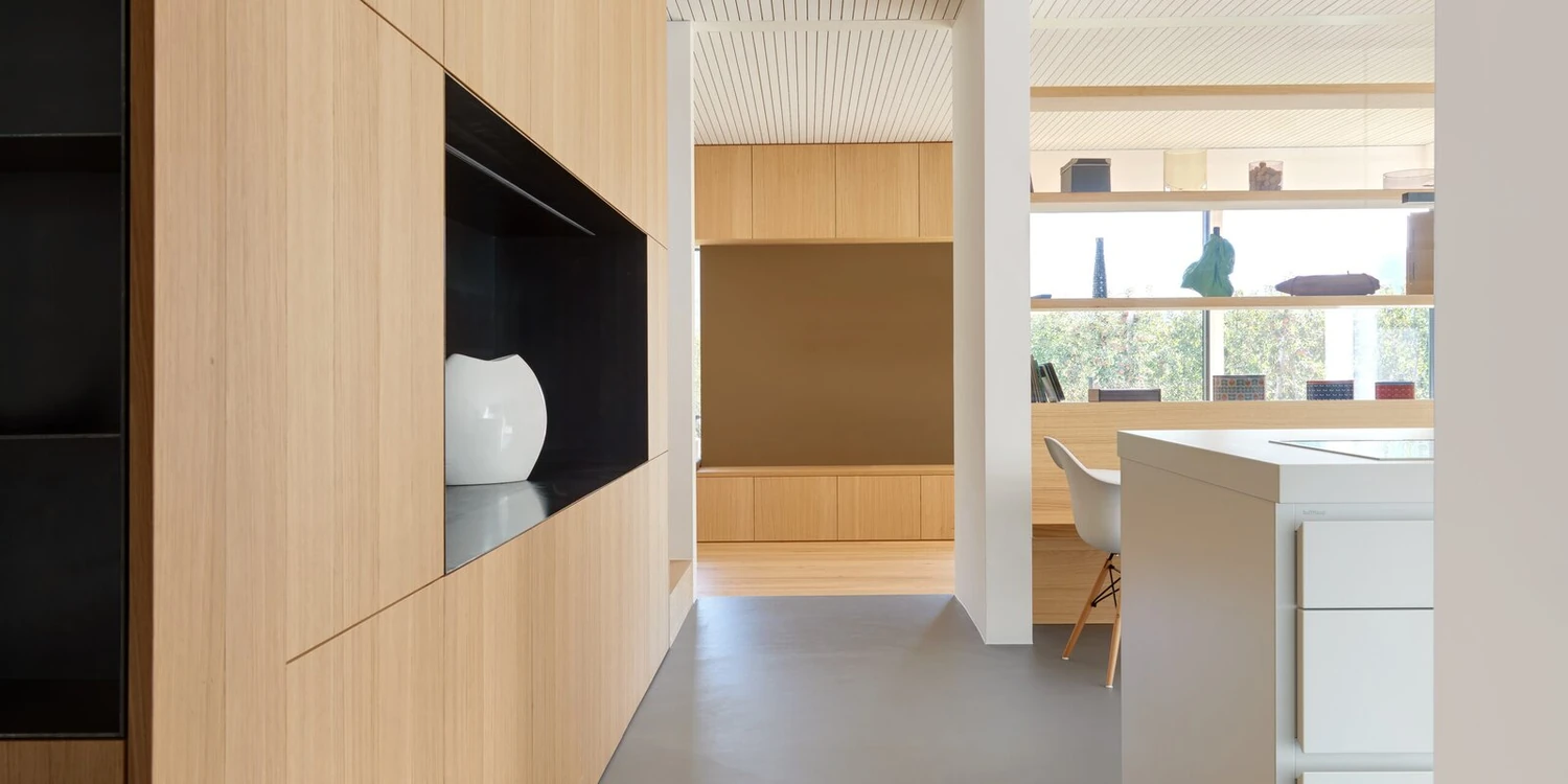 LignoAlp home interior with timber-lined walls and a bright dining area