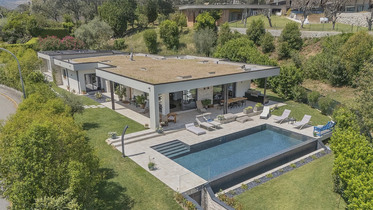 Marlegno prefab timber villa in Soiano del Lago with a planted roof and swimming pool