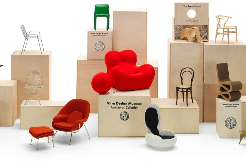 Gifts for architects Vitra miniatures of iconic chairs displayed on boxes