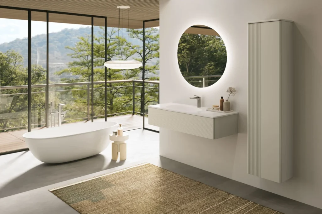 Bright contemporary bathroom with freestanding bath, wall-hung vanity and floor-to-ceiling windows