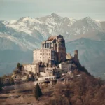 La Sacra di San Michele sulla vetta del Monte Pirchiriano con le Alpi innevate sullo sfondo