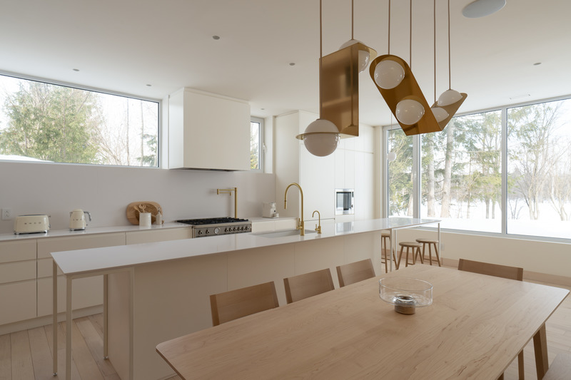 Kitchen and dining area at the MI-1 Residence by Dupont Blouin