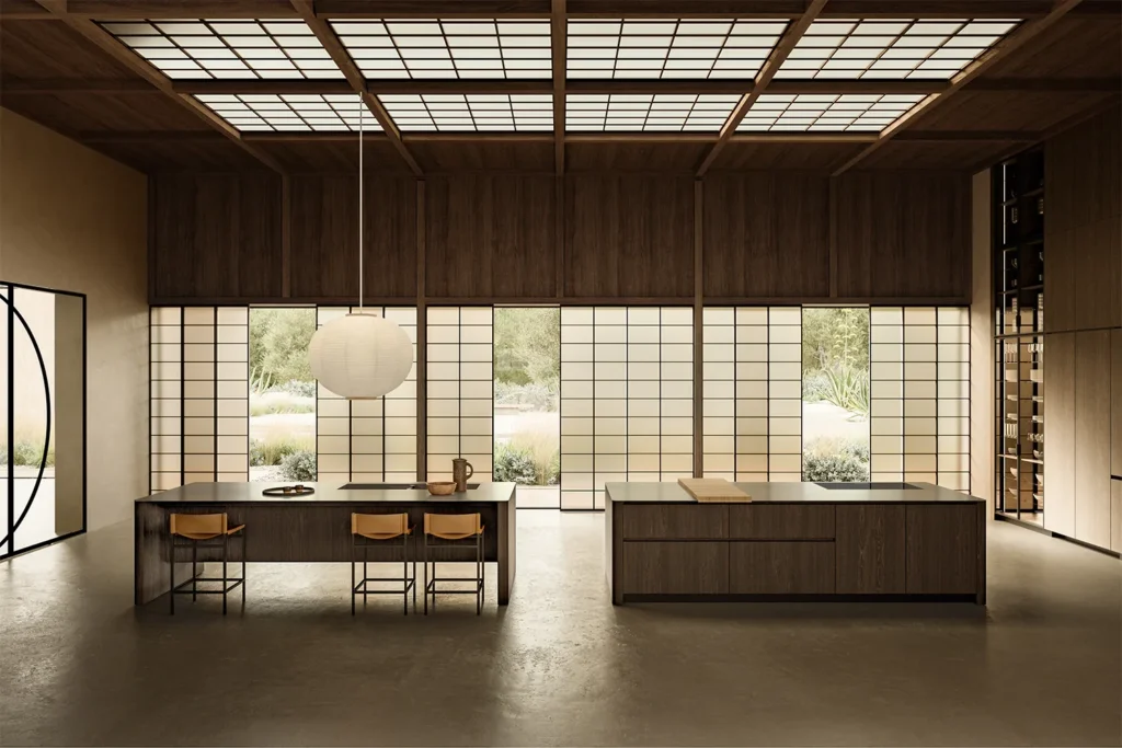 Kitchen with two monolithic dark wood islands beneath a grid skylight and large glazed walls