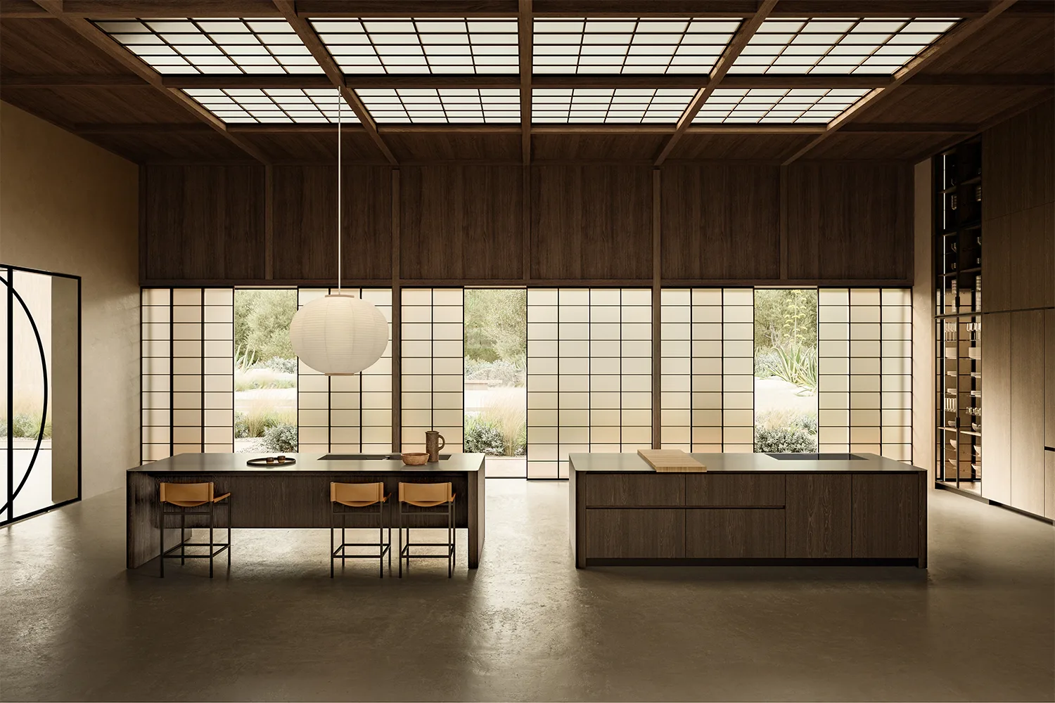 Cucina con due isole monolitiche in legno scuro sotto un soffitto a lucernari e grandi vetrate