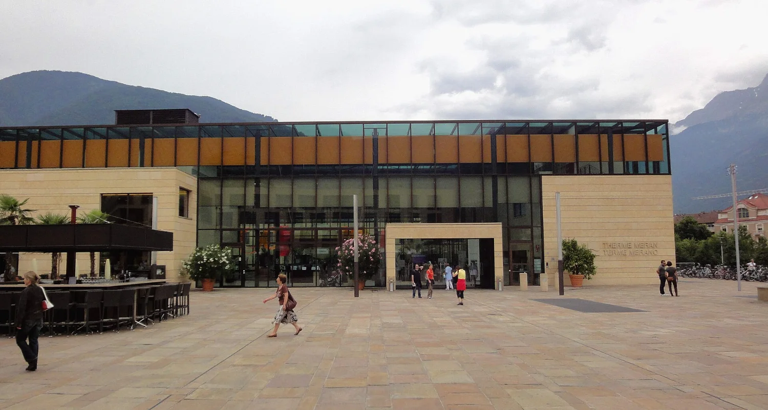 Matteo Thun’s Terme Merano on Piazza Terme with the mountains behind